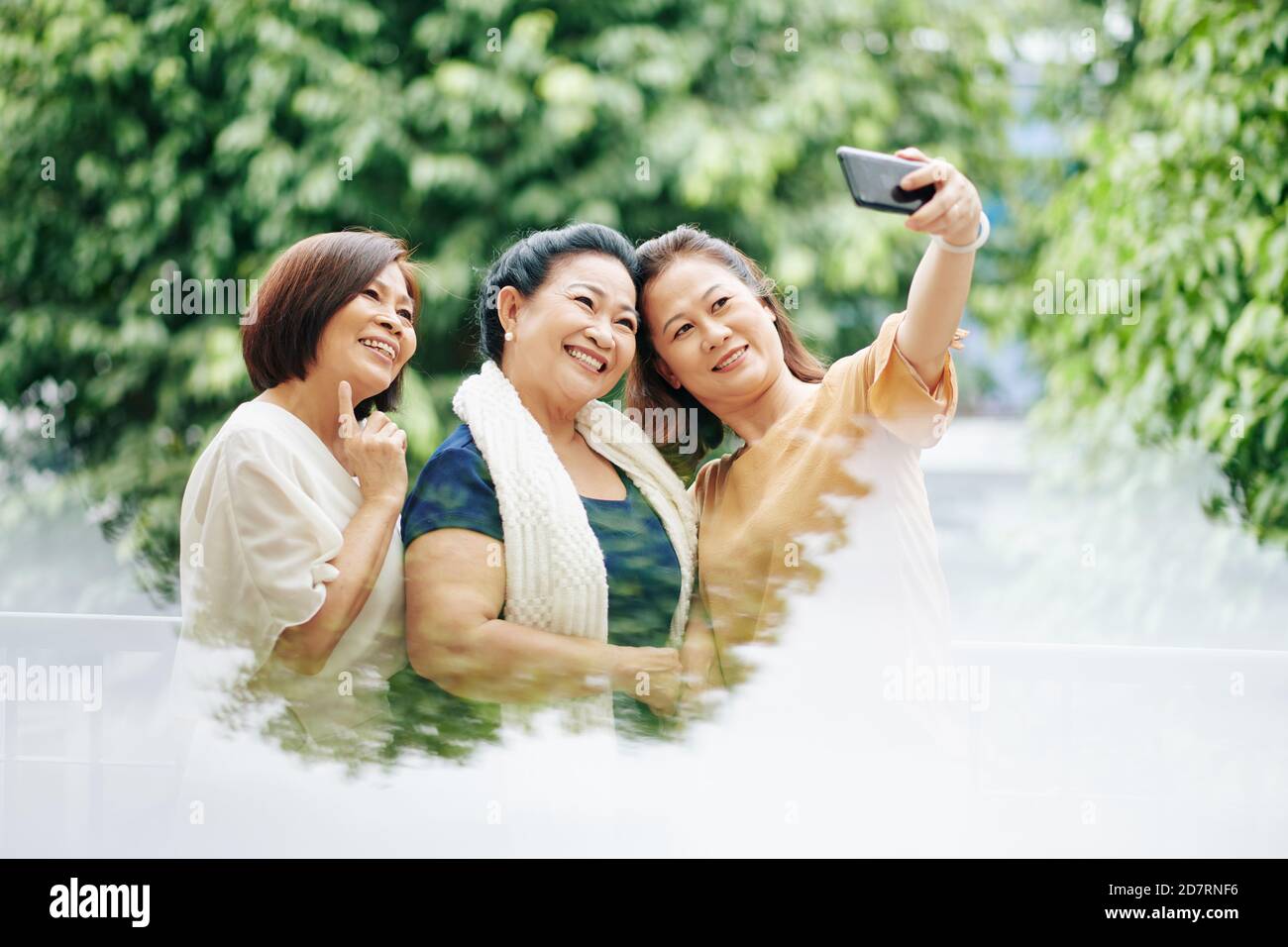 Senior friends taking selfie Stock Photo