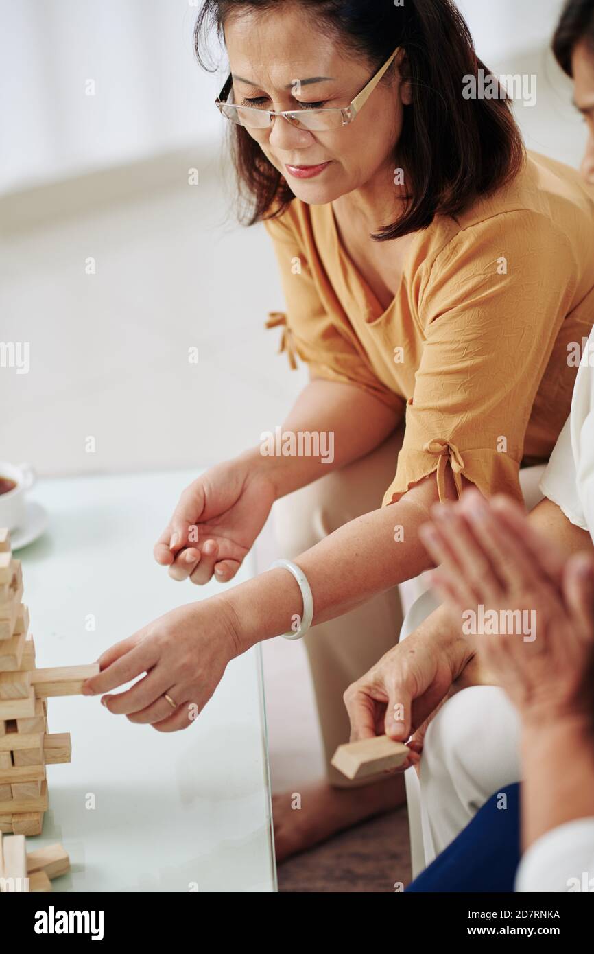 Woman removing block from hi-res stock photography and images - Alamy