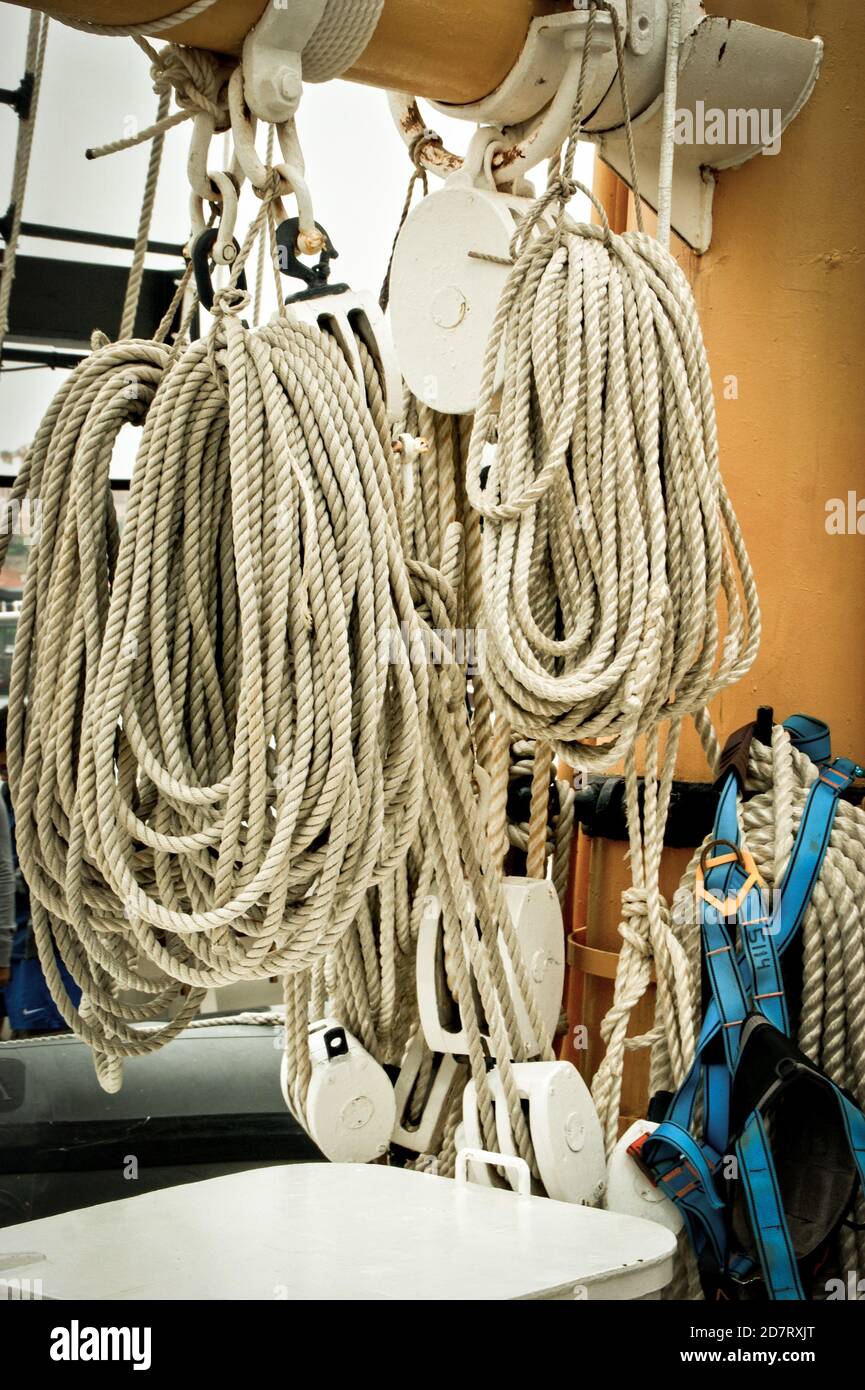 Coiled craft navy rope in seaport Stock Photo - Alamy