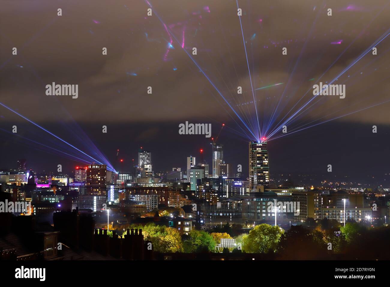 Interactive laser show in the skies above Leeds City during Laser Light  City event Stock Photo - Alamy