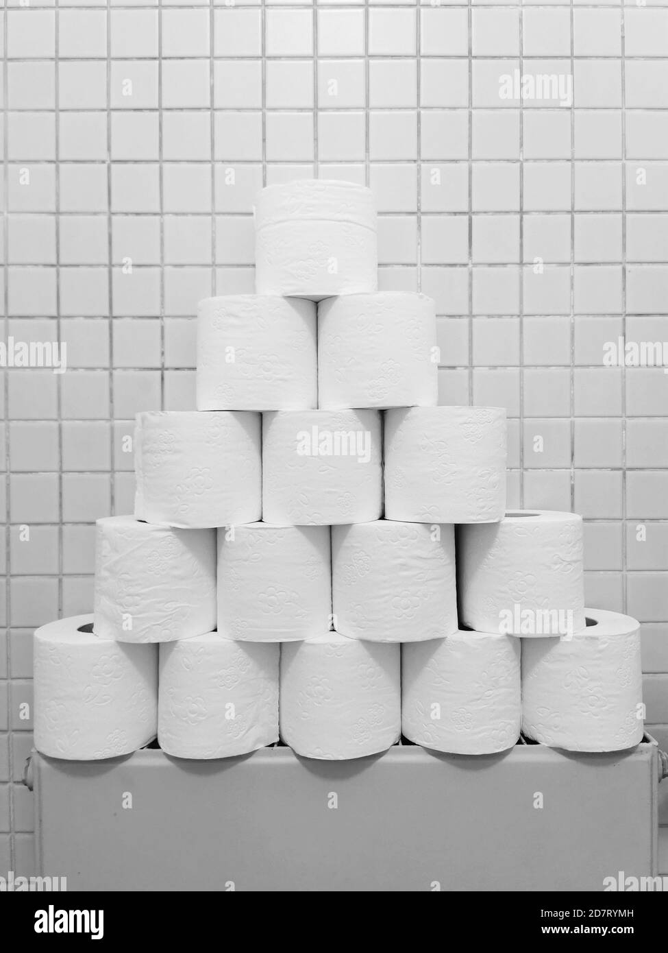 corona scenery showing a pyramid of toilet rolls in a lavatory Stock Photo