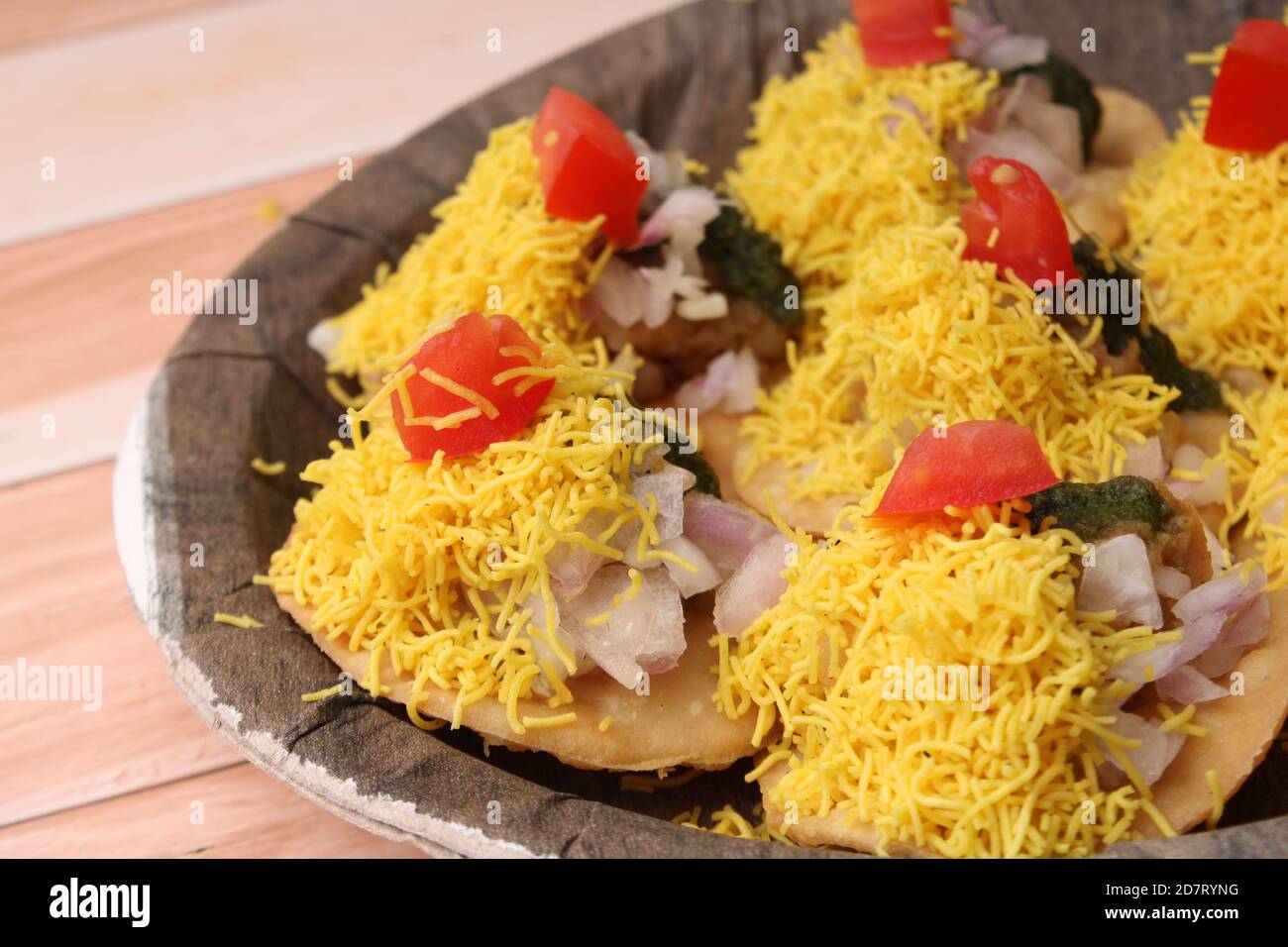 Sev Batata Puri OR Papdi chat - popular indian snacks or street food. Stock Photo