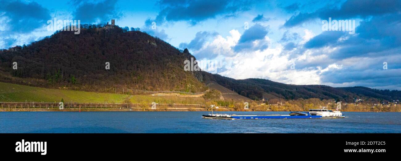 GERMANY, BONN. A cargo navigating the Rhine river below castle Drachenfels Stock Photo
