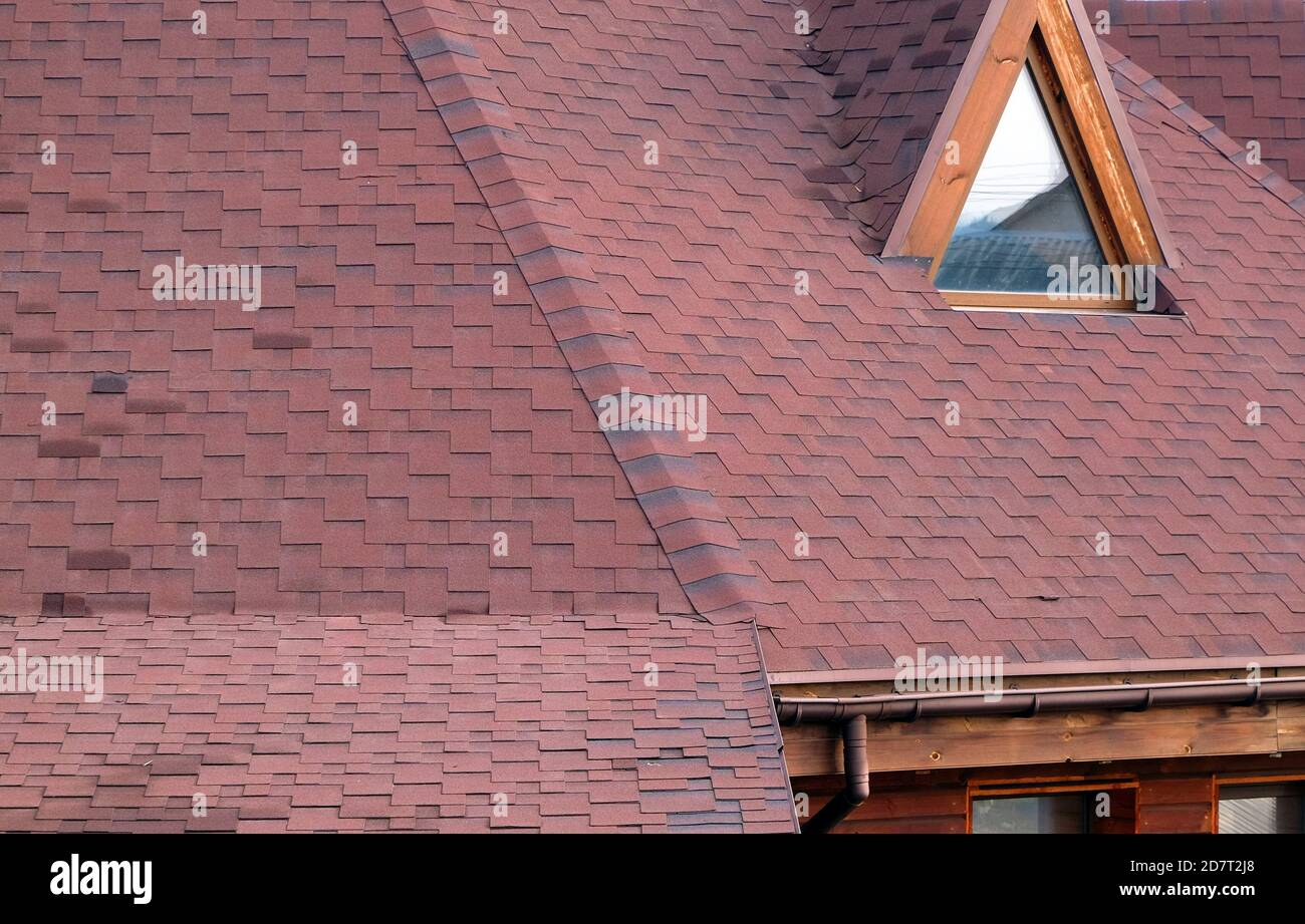 Roof Asphalt Shingles and Attic Mansard Window. Roofing Construction. Roofing Repair. Rain