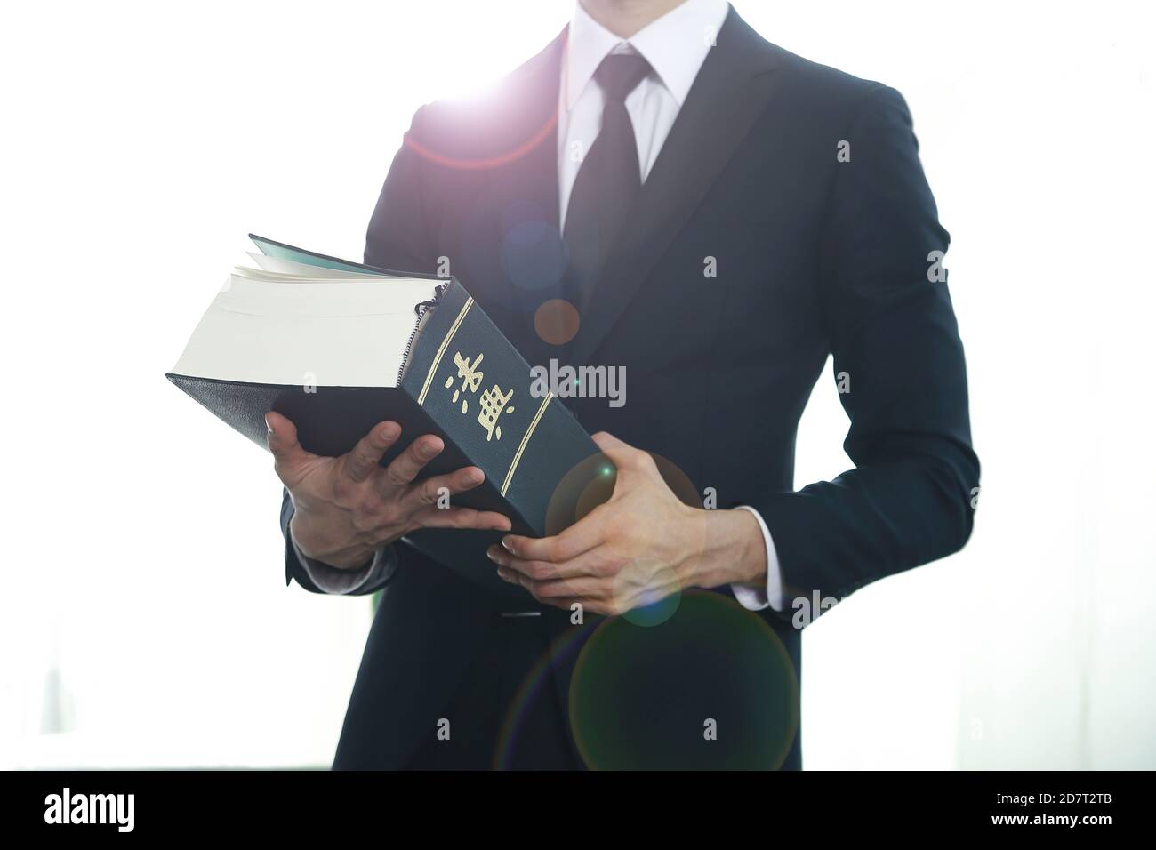 Lawyer holding law book.Chinese character 'beobjeon' means code of laws
