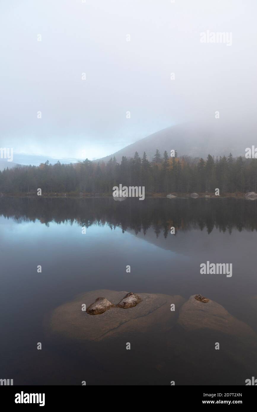 Foggy morning sunrise at Sandy Stream Pond in October, Baxter State Park, Maine Stock Photo