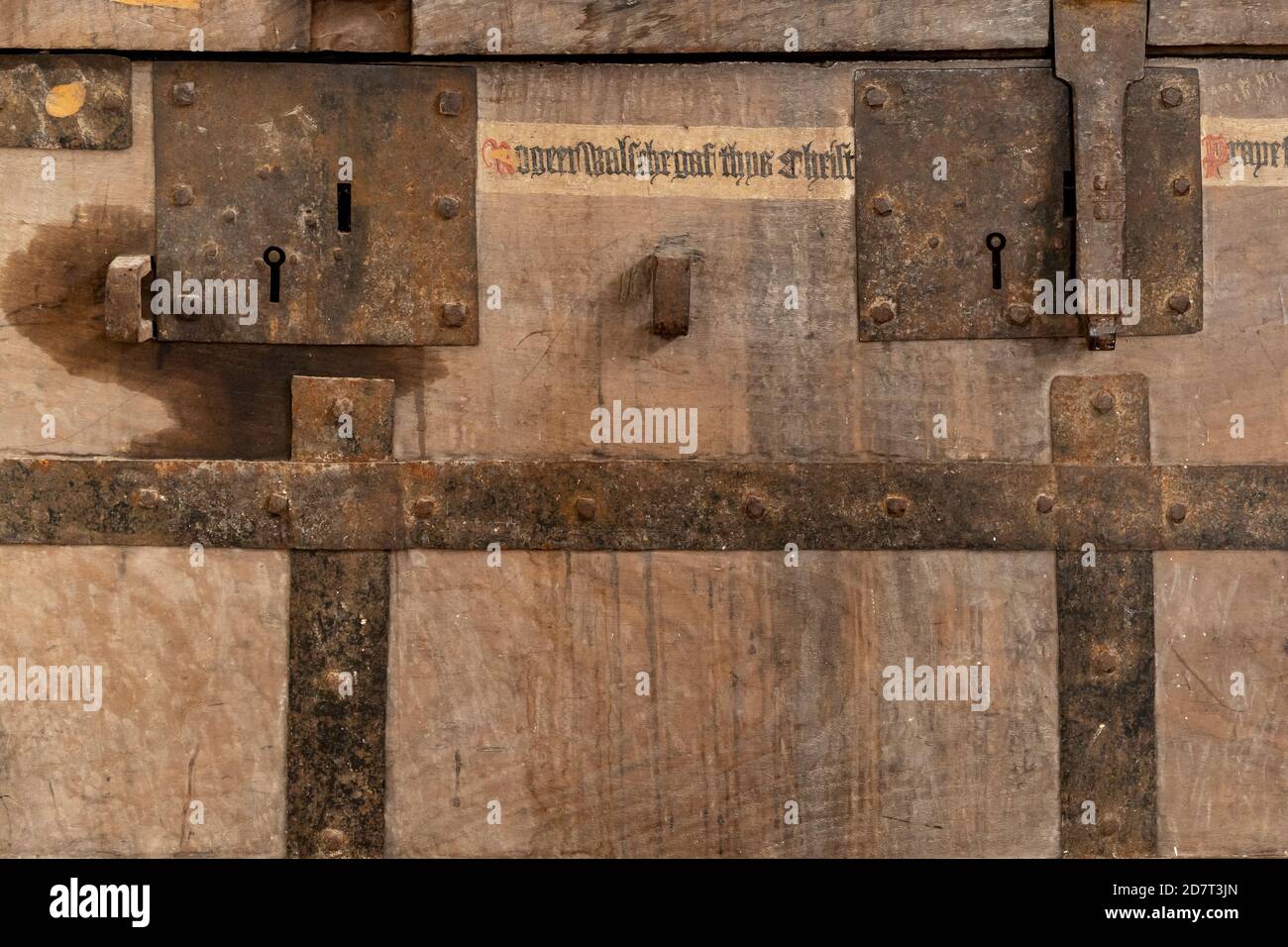 Antique wooden chest with two hasp locks and metal strapping Stock