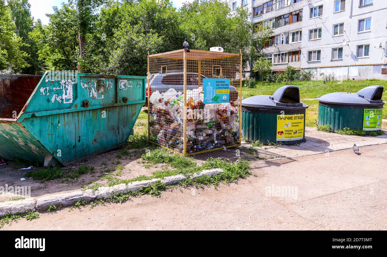 Novokuybyshevsk, Russia - July 3, 2020: Different containers for separate waste collection. Text in russian: Other waste, Dry waste Stock Photo