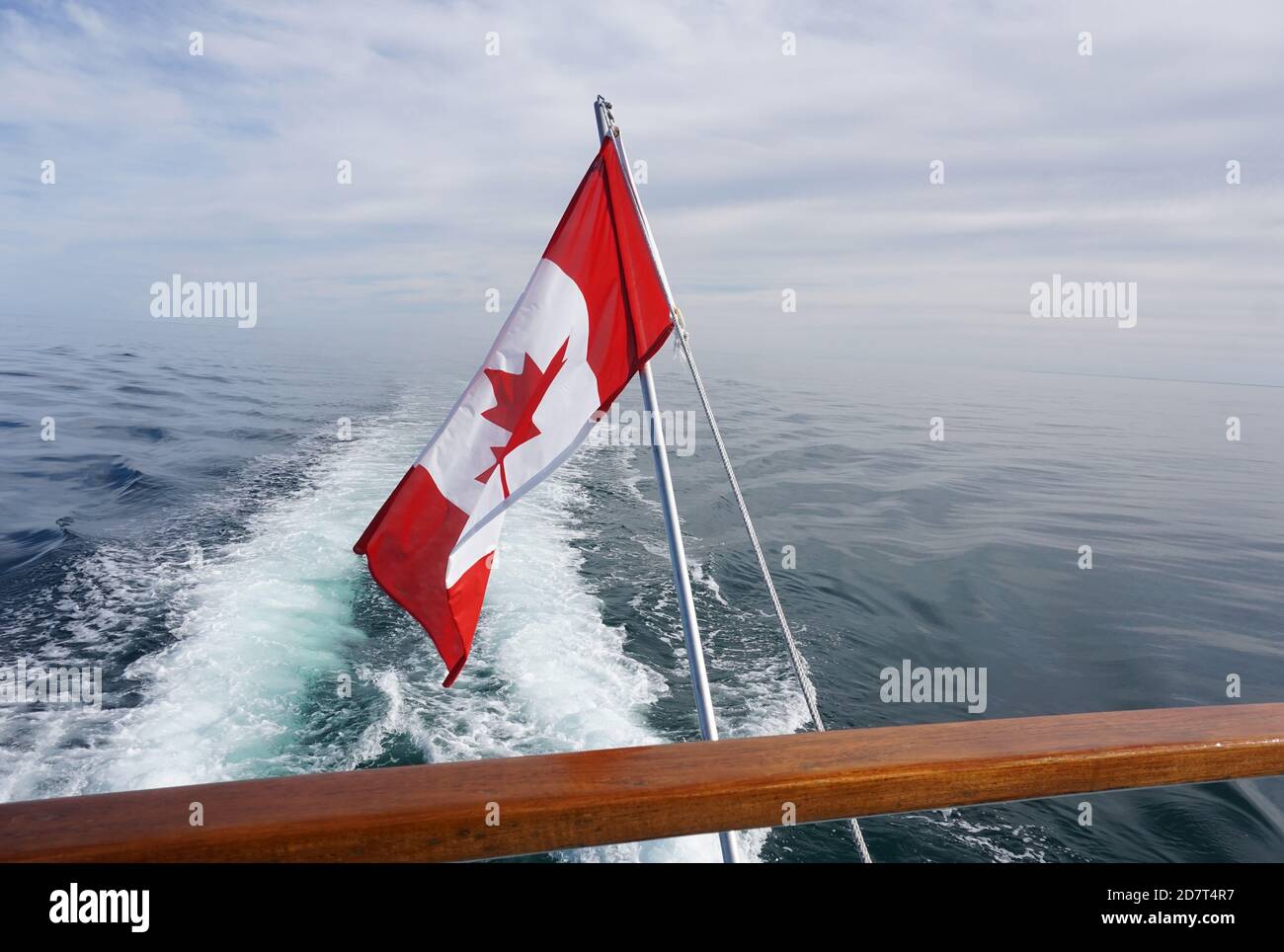 Canadian flag flying on a boat, Bay of Fundy Stock Photo - Alamy