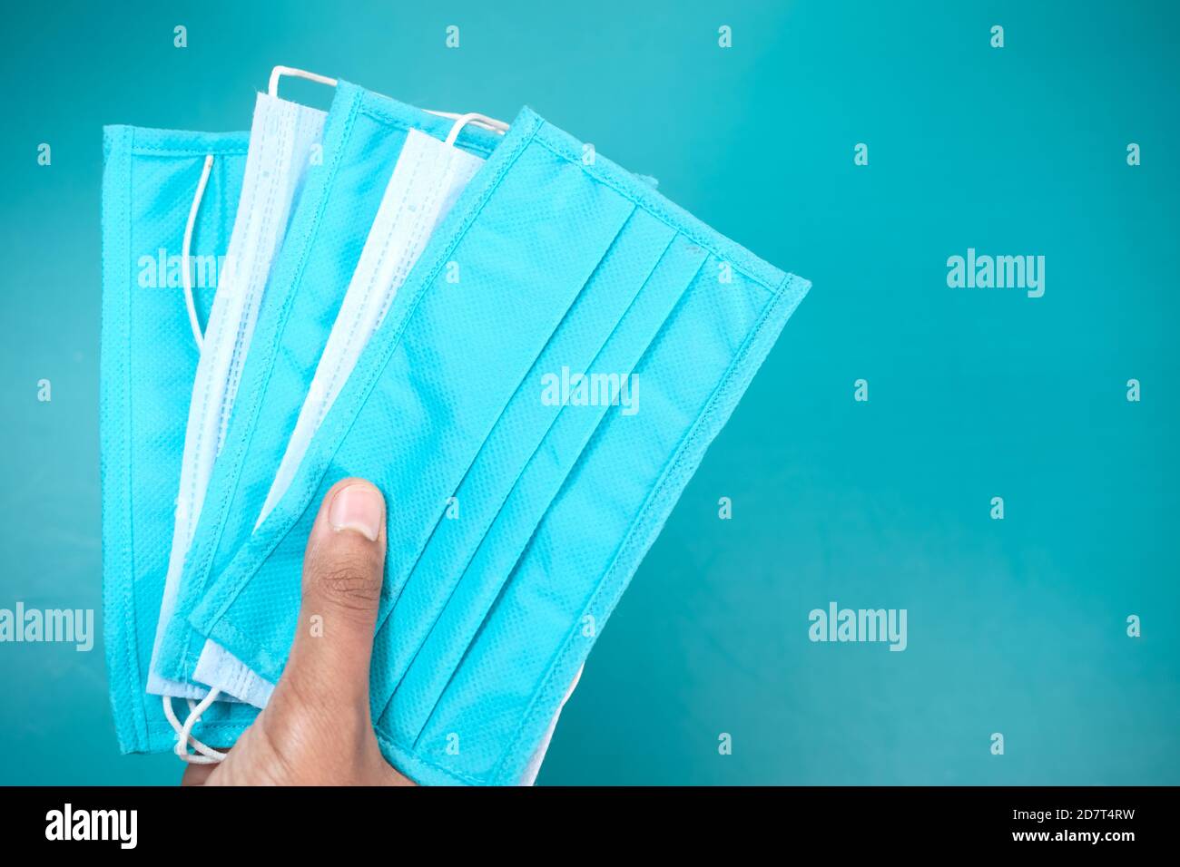man hand holding surgical face mask, close up Stock Photo - Alamy