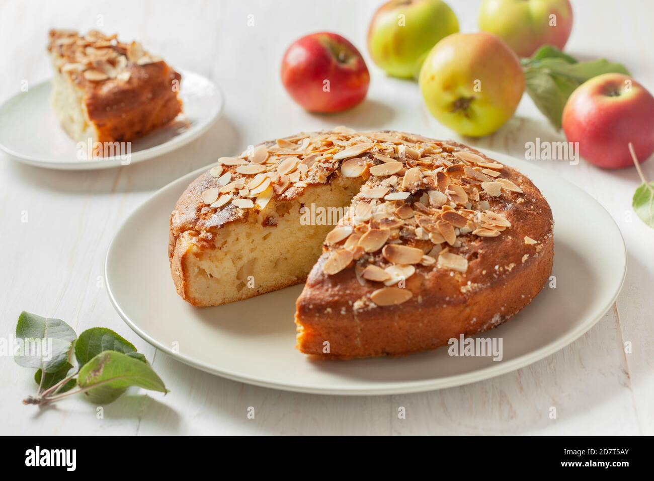 apple cake (apple apfel kuchen), fresh apples on a wooden background. Stock Photo