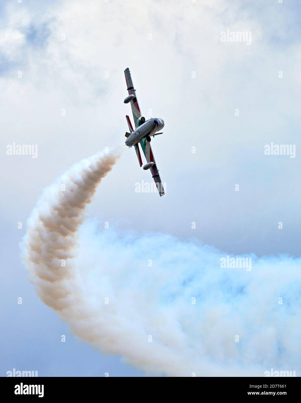 Aermacchi MB-339 of the Frecce Tricolori Italian Air Force aerobatic display team, banking left and trailing white smoke at RIAT 2019 Stock Photo
