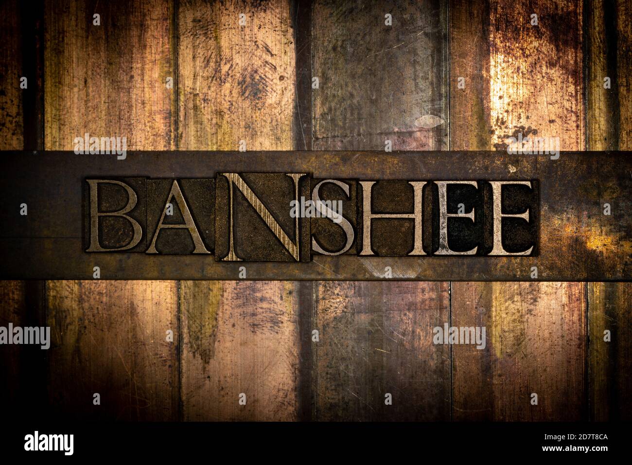 Banshee text message on vintage textured grunge bronze background Stock Photo