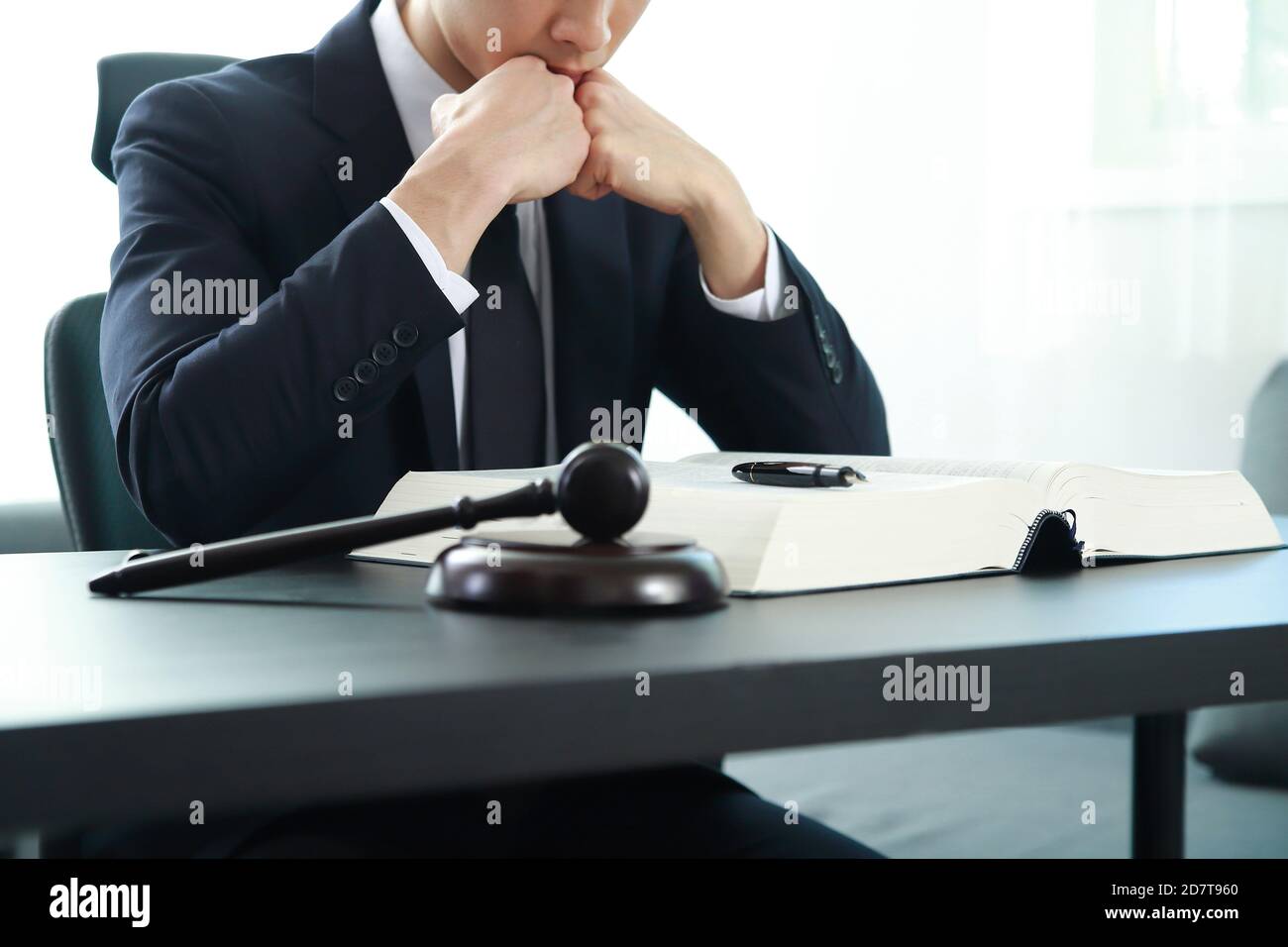 Lawyer businessman working or reading law book in office Stock Photo - Alamy