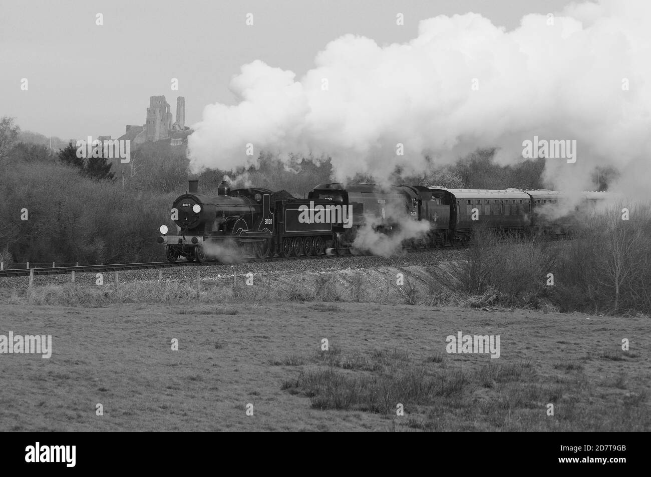 '34120' leading 'Manston' south of Corfe Castle, with the castle visible in the background. Stock Photo