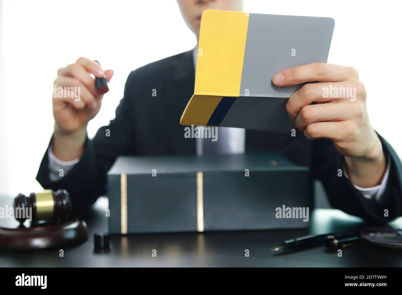 Lawyer holding stamp with law book Stock Photo Alamy
