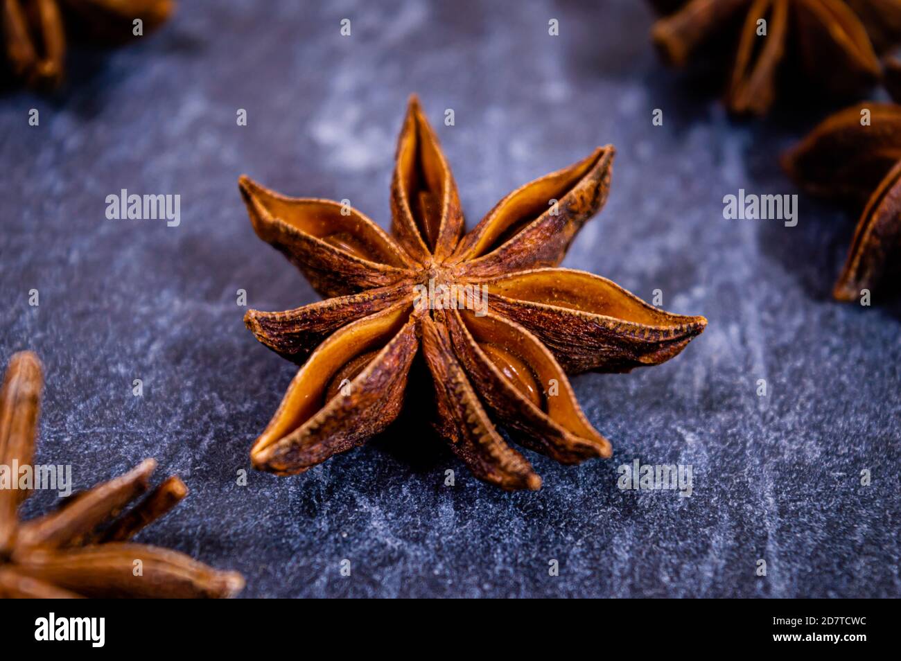 Closeup of star anise seed pods against a dark surface Stock Photo Alamy