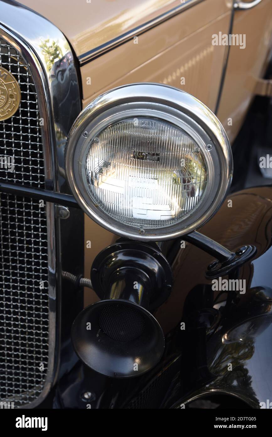 Antique Headlight or Headlamp & Car Horn, Vehicle Horn, Bulb Horn or Klaxon on Vintage 1930 Ford Model A Car or Automobile Stock Photo