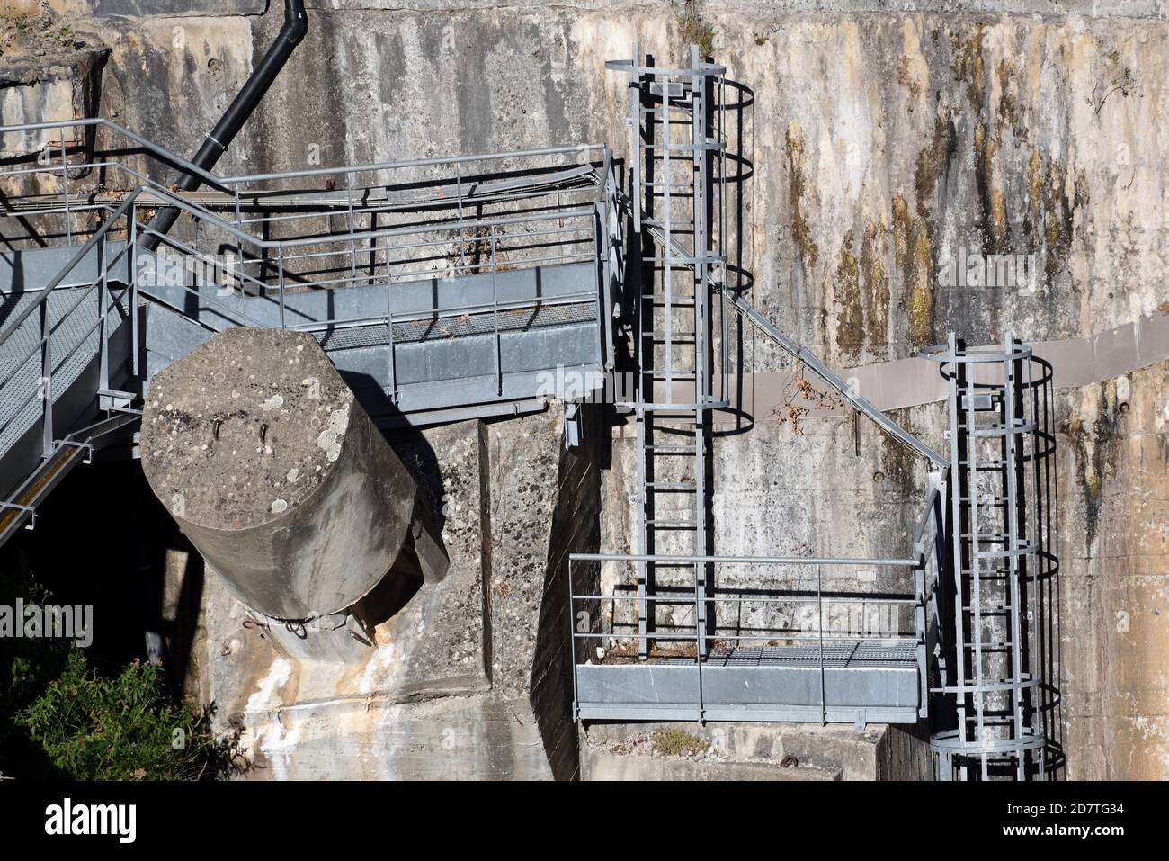 Industrial Security Ladders, Wall Ladders, Safety Ladders & Work Platforms Fixed to Concrete Wall of Castillon Dam or Barrage Provence France Stock Photo