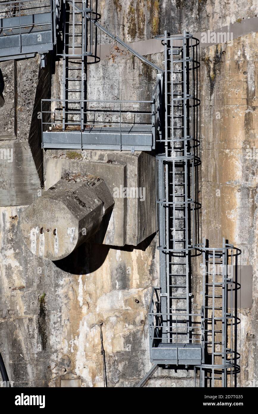 Industrial Security Ladders, Wall Ladders, Safety Ladders & Work Platforms Fixed to Concrete Wall of Castillon Dam or Barrage Provence France Stock Photo