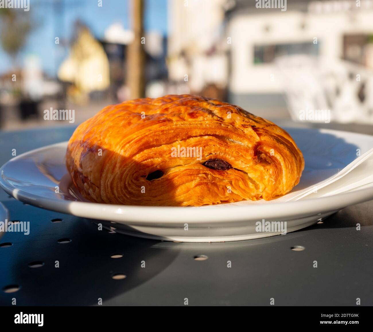 Pain au Chocolate pastry on a plate at an outside street cafe Stock Photo