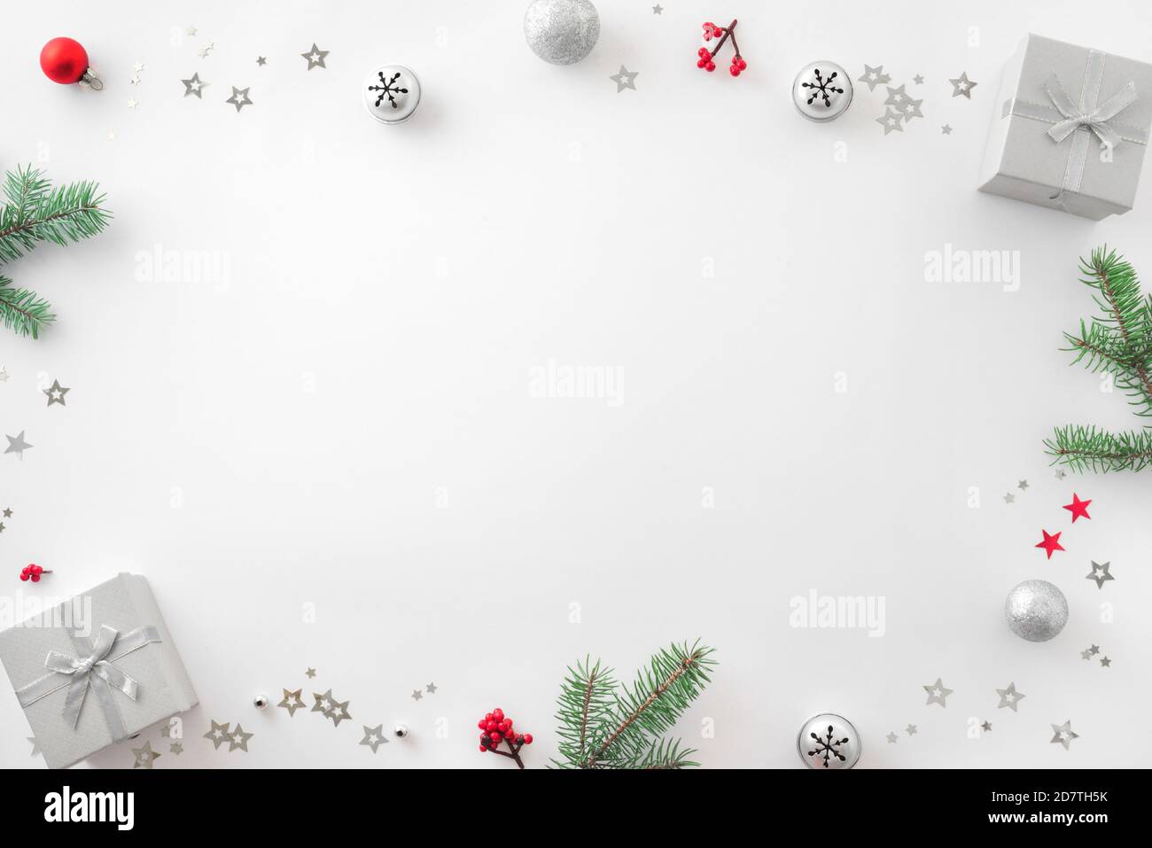 Christmas composition. Christmas decor, gift boxes, pine cones on white background. Top view, copy space. Stock Photo