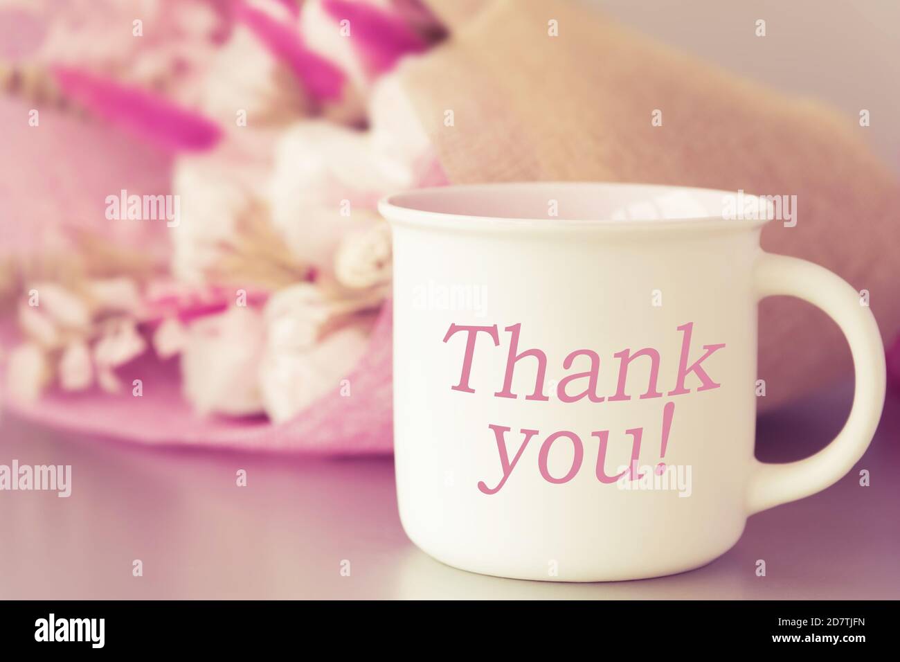 Thank you on coffee or tea cup, flower bouquet Stock Photo