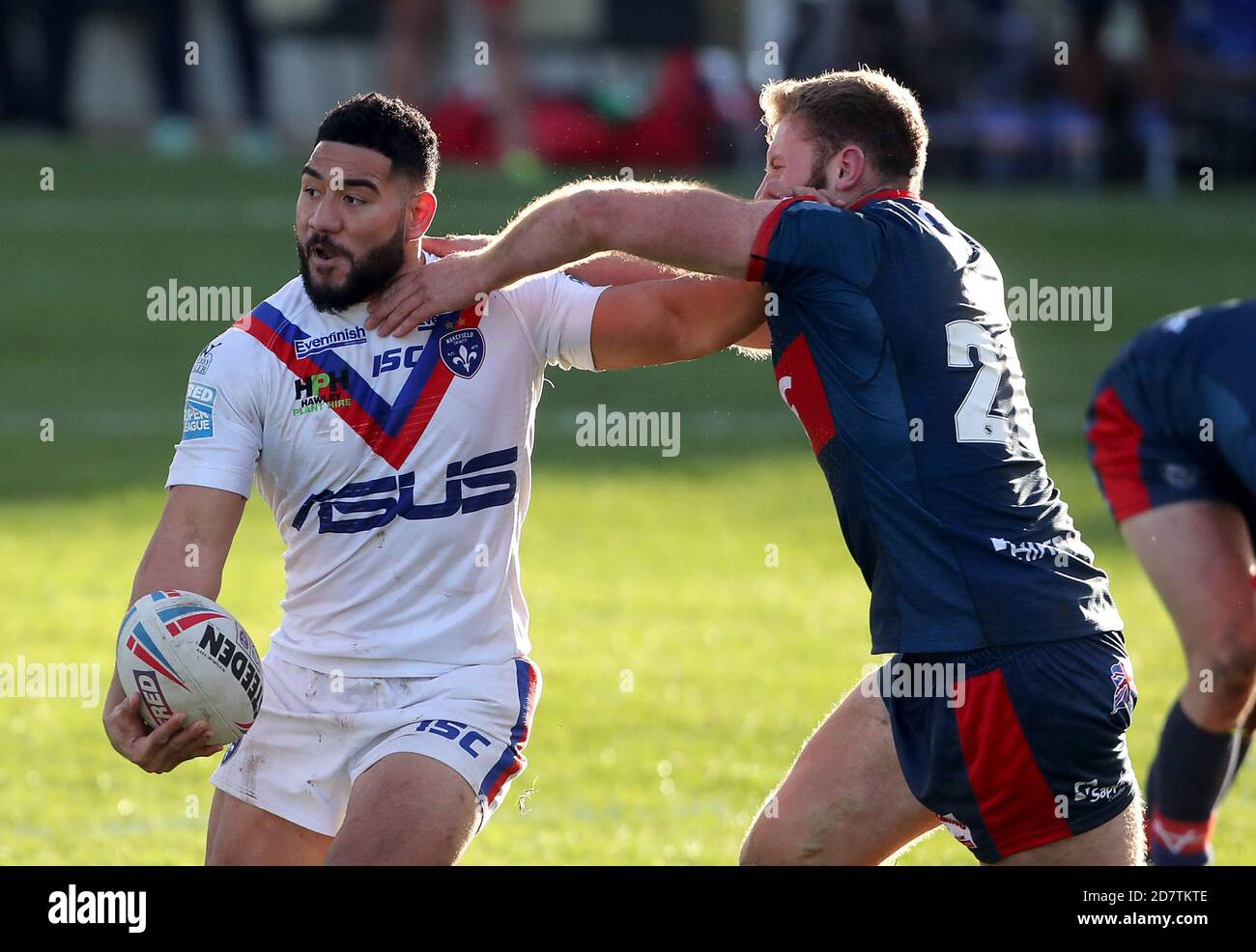 Wakefield Trinity's Kelepi Tanginoa is tackled by Hull Kr's Will Maher during the Betfred Super League match at the Mobile Rocket Stadium, Wakefield. Stock Photo