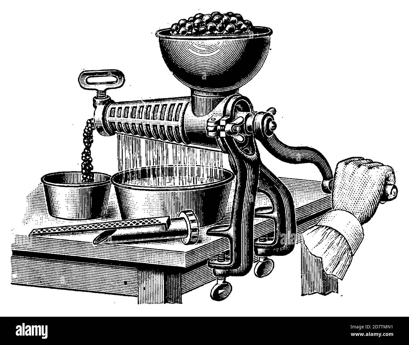 Old-style traditional fruit press for juice extraction. Kitchen utensil from 19th century. Stock Photo