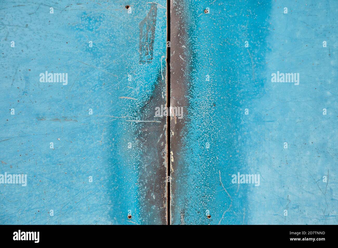 Crack between worn metal doors, turquoise; Tokyo Stock Photo