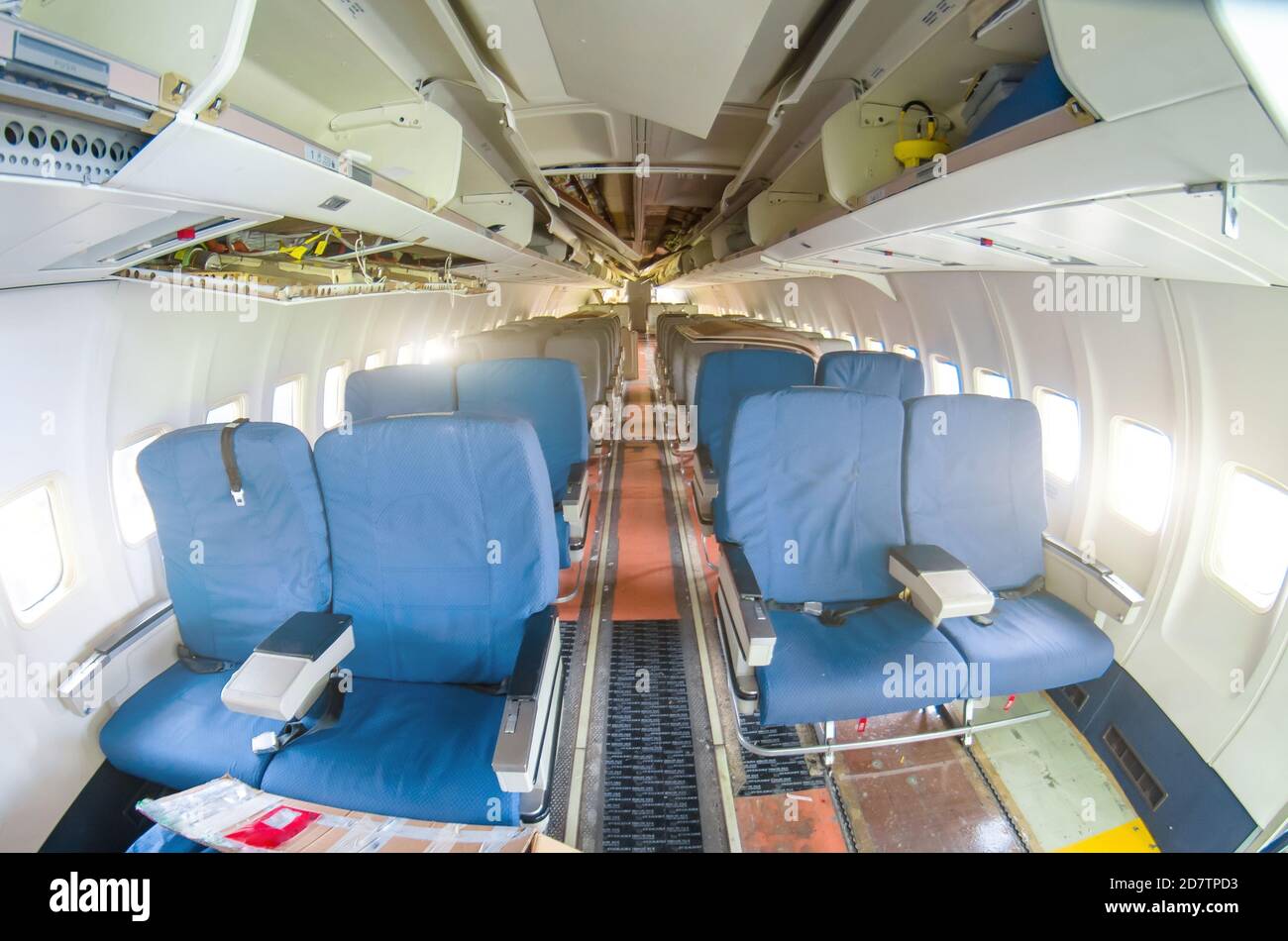 Destroyed passenger cabin aircraft. Torn off passenger seats destroyed interior cabin airplane with seats, for repairs Stock Photo
