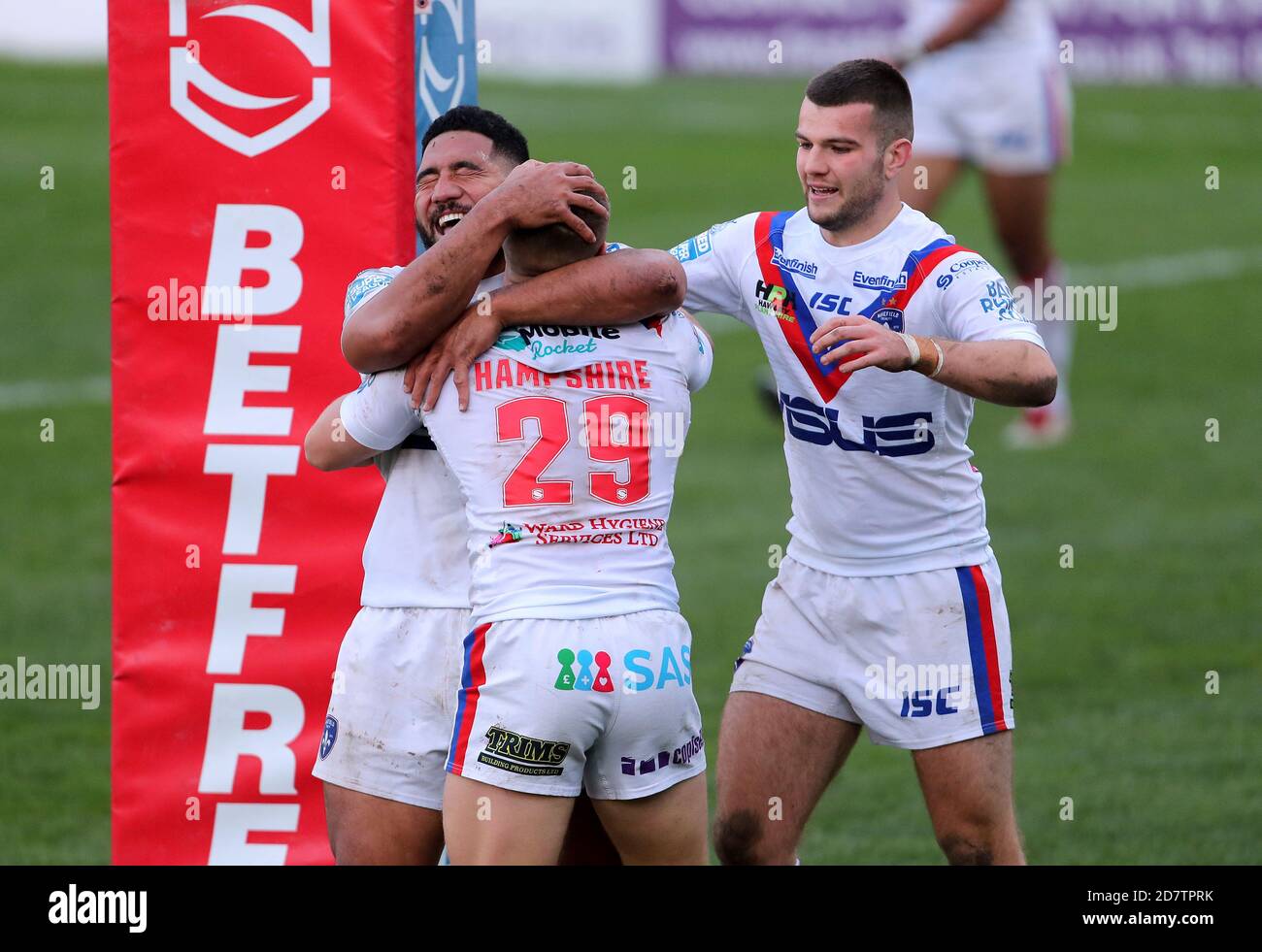 Wakefield Trinity's Ryan Hampshire celebrates scoring a try with Kelepi Tanginoa (left) during the Betfred Super League match at the Mobile Rocket Stadium, Wakefield. Stock Photo