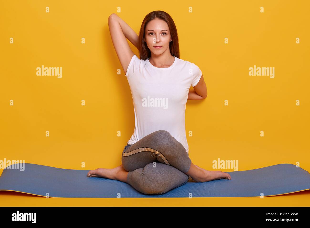 Little girl sitting in yoga pose over color background. Stock Photo | Adobe  Stock