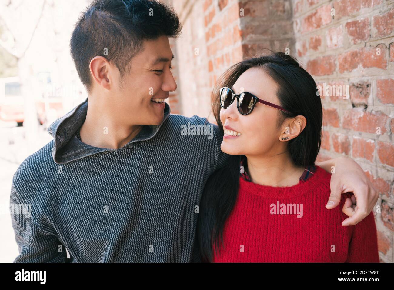 Portrait of young Asian couple in love walking in the city and having good time together. Love concept. Stock Photo