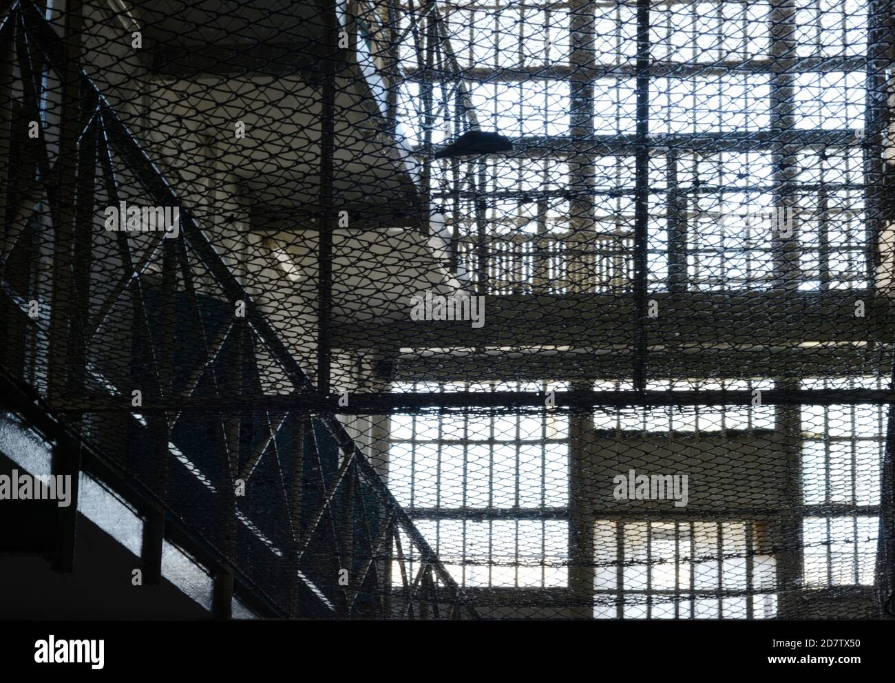 Old prison bars and safety nets Stock Photo