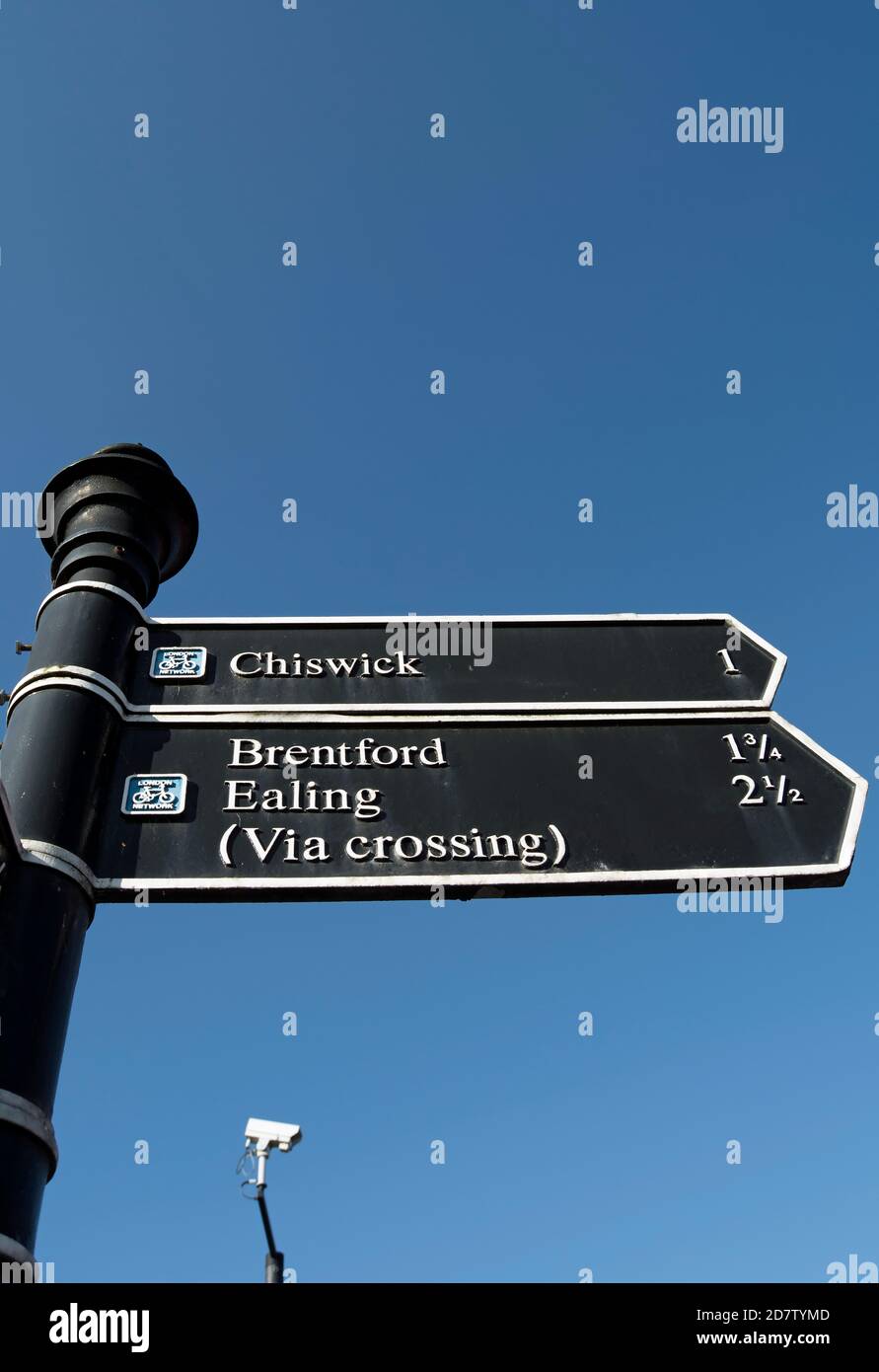 right pointing signs giving directions and distances to chiswick