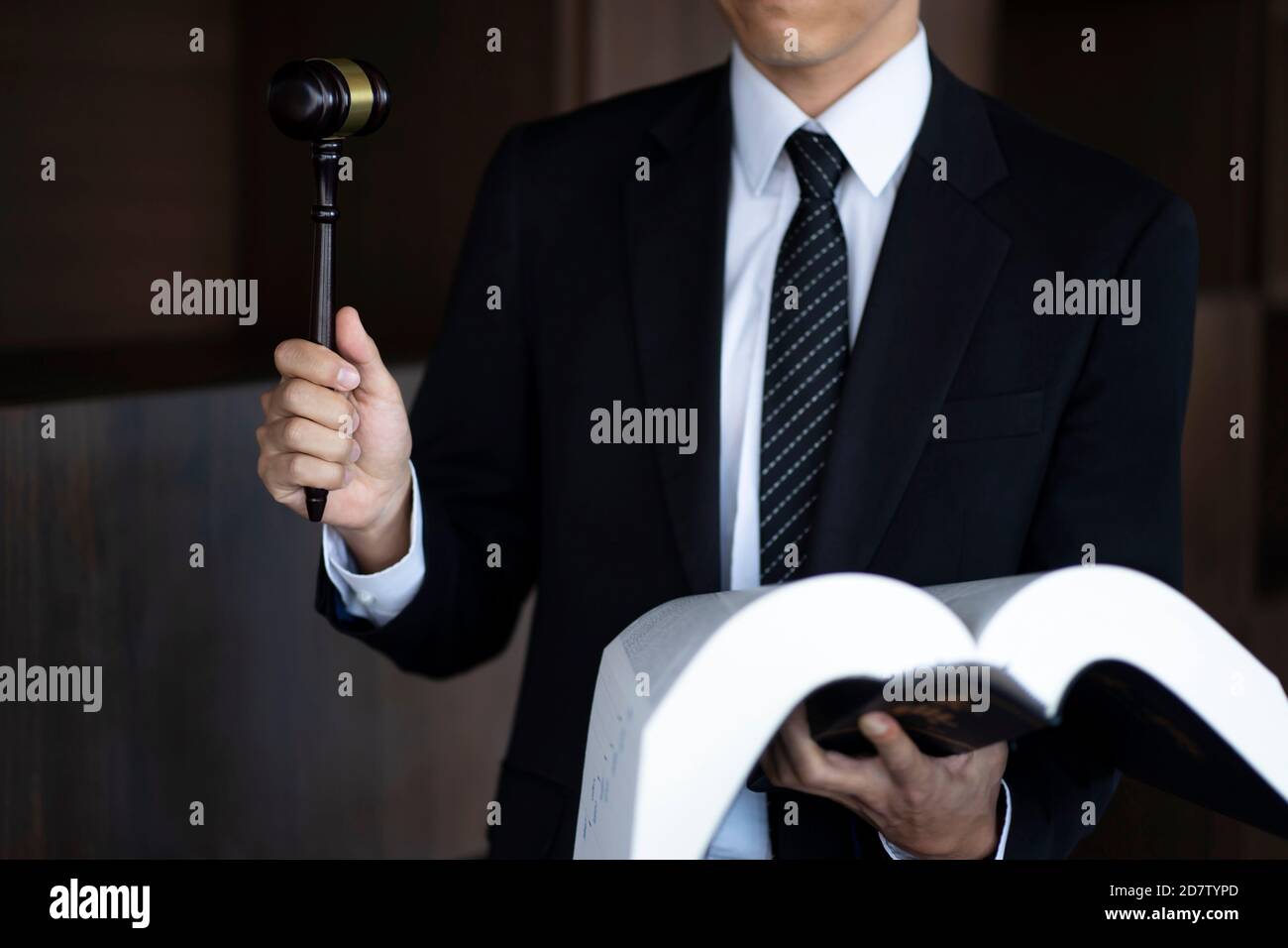 Lawyer holding gavel and law book Stock Photo