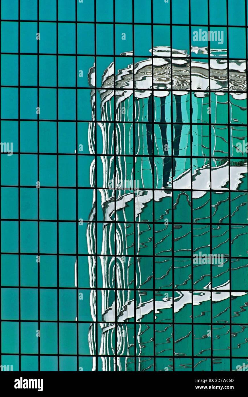 Digital art from an original photograph of the upper levels of the 33-storey CITIC Tower in Hong Kong, China, reflected in the reflective cladding of a nearby high-rise building.  The CITIC Tower, corporate headquarters of the CITIC Pacific Ltd conglomerate, was built in 1997 on a site in Tim Mei Avenue in the Admiralty central business district.  It rises to a height of 126 metres (413 feet) and offers fine views over historic Victoria Harbour. Stock Photo