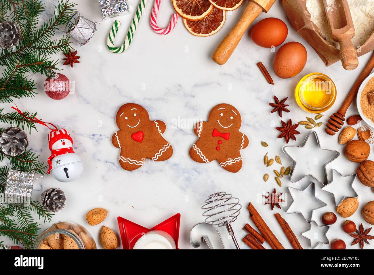 Flour New Year background. Christmas tree branches, gingerbread cookies,  spices and baking supplies on black wood background. Christmas, New Year  gree Stock Photo - Alamy