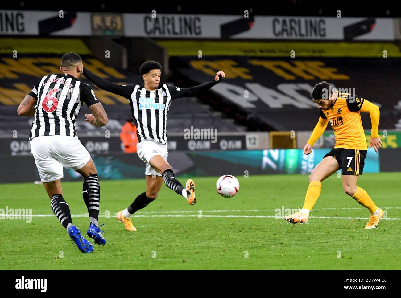 Wolverhampton Wanderers' Pedro Neto (right) has a shot on goal during the Premier League match at Molineux, Wolverhampton. Stock Photo