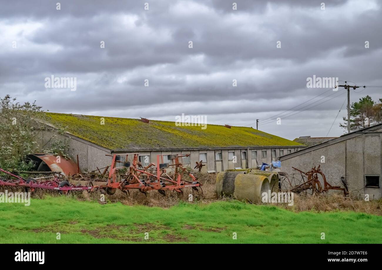 Old farmyard and agricultural equipment in rural Norfolk Stock Photo
