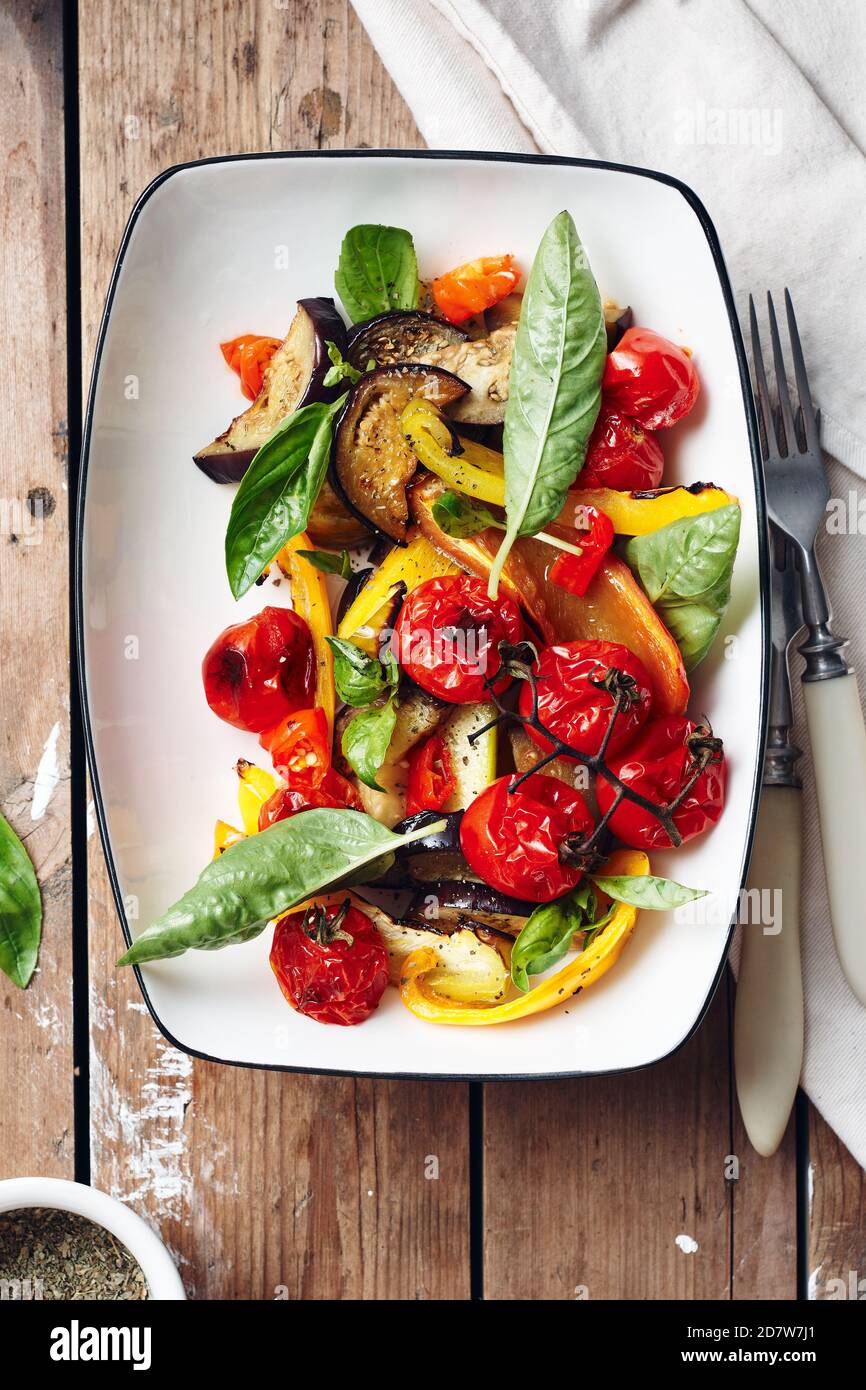 Salad with roasted tomatoes, eggplants, zucchini, bell peppers and