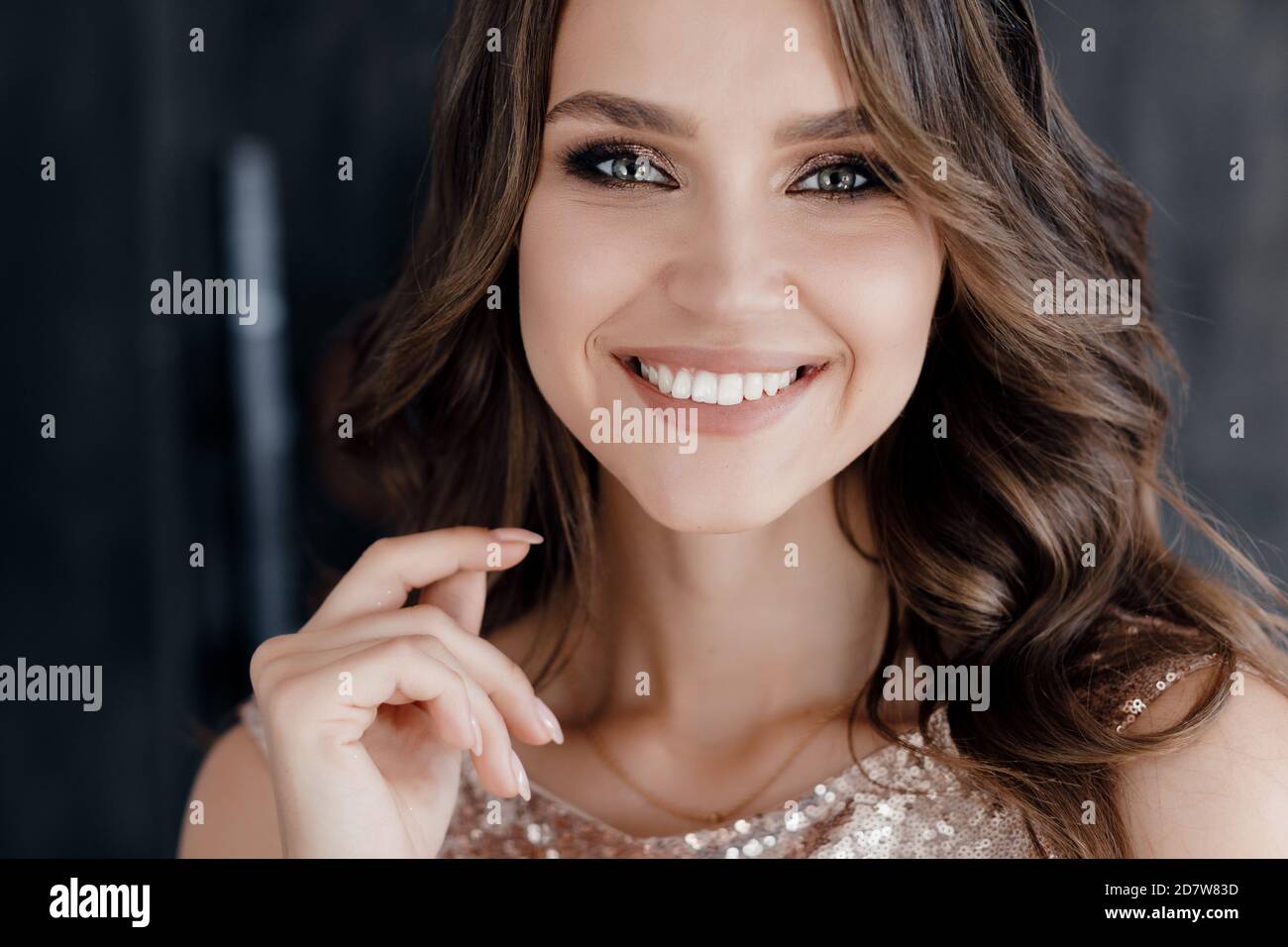 Closeup portrait of a young beautiful woman in dress indoor Stock Photo ...