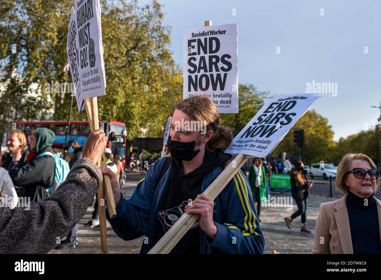 LONDON, ENGLAND - OCTOBER 25: Protestor against SARS police unit is being video interviewed in Marble Arch. British Nigerians are protesting against... Stock Photo
