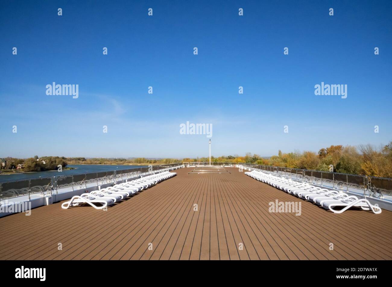 Cruise ship sun deck with line of lounge chairs Stock Photo - Alamy