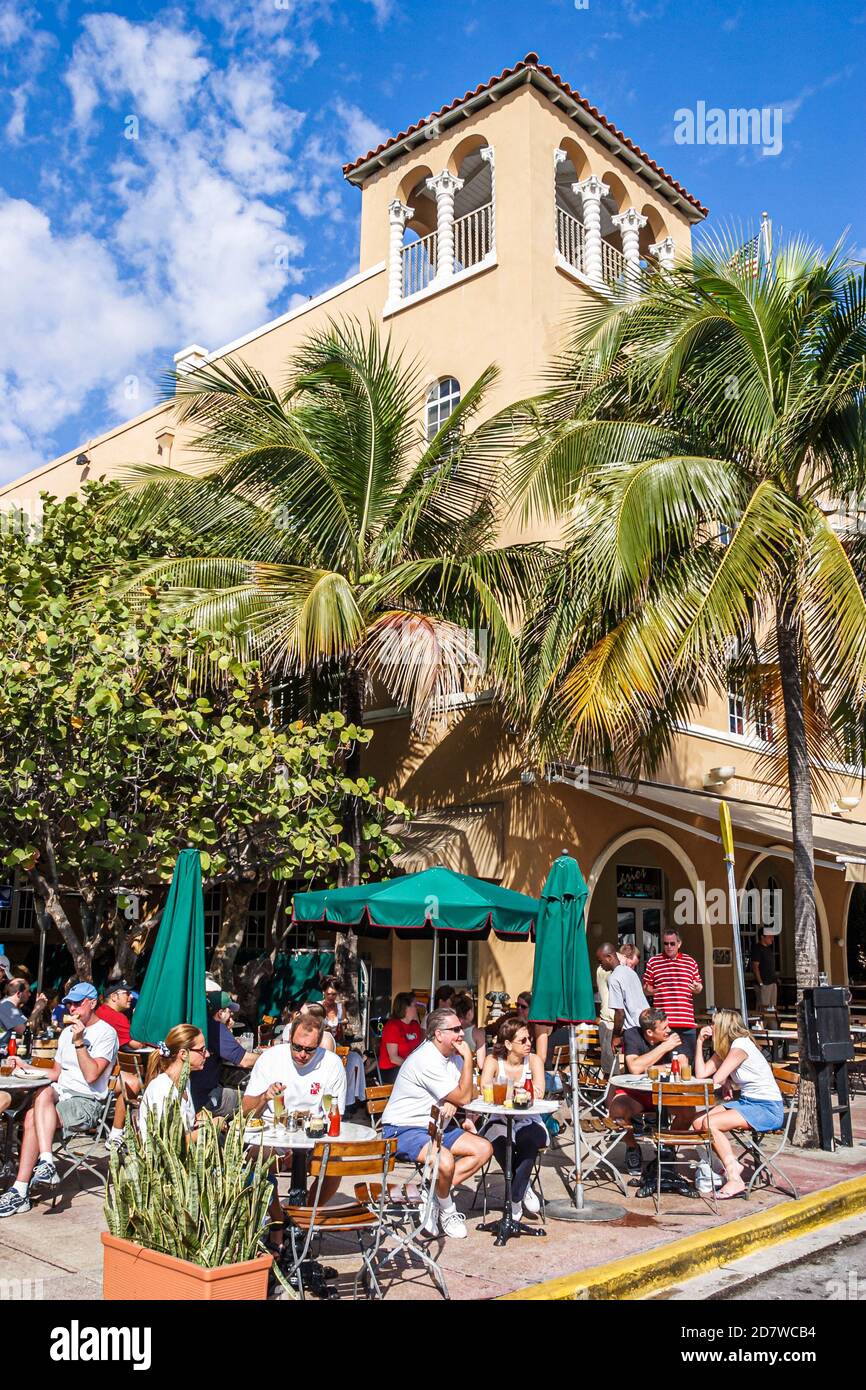Miami Beach Florida,Art Deco Weekend South Beach,Ocean Drive,News Cafe al fresco sidewalk,dining umbrellas tables palm trees, Stock Photo