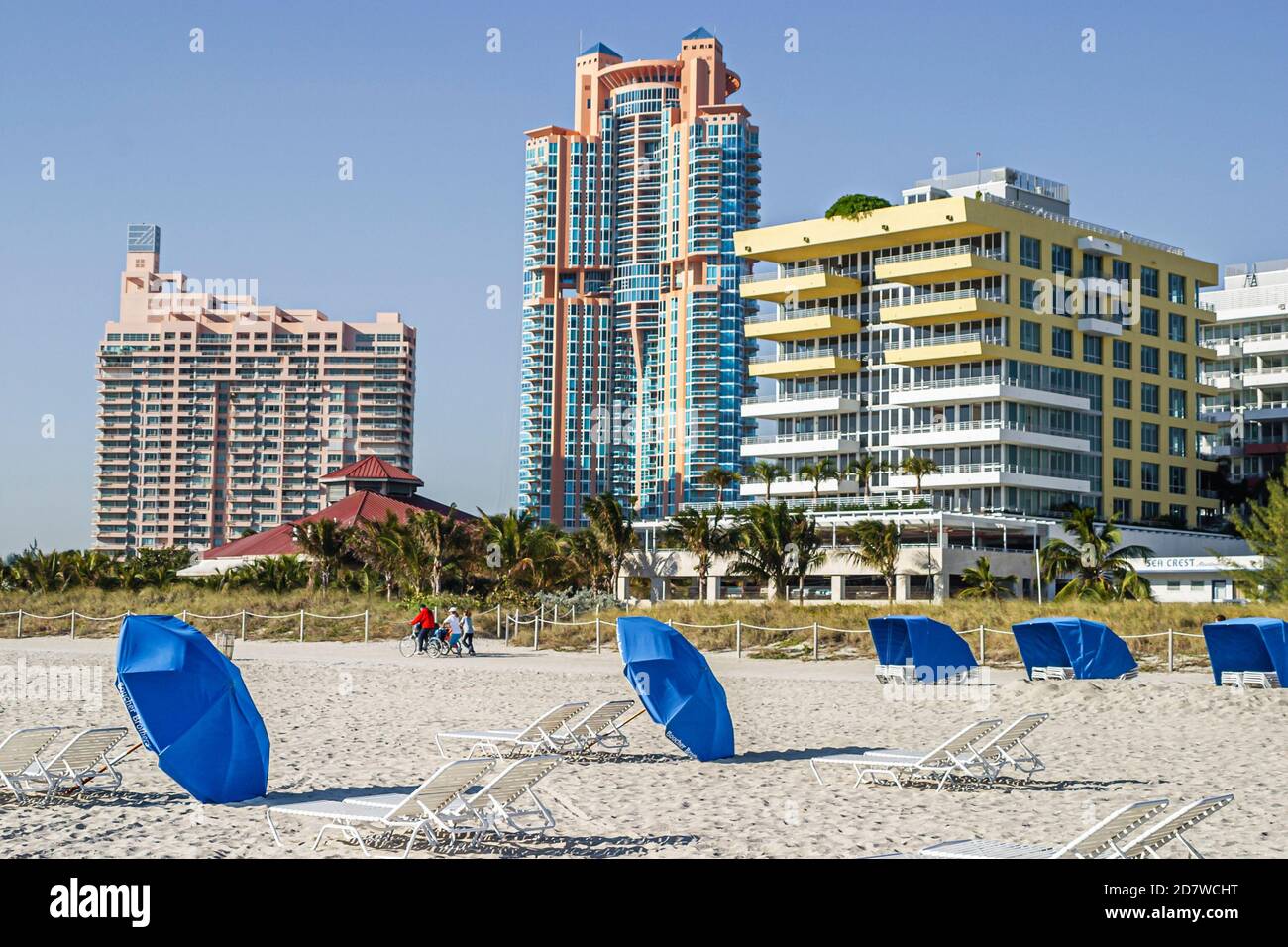 Miami Beach Florida,Atlantic Ocean seashore,rental umbrellas,high rise building buildings condominiums,residences,condominium residential apartment ap Stock Photo
