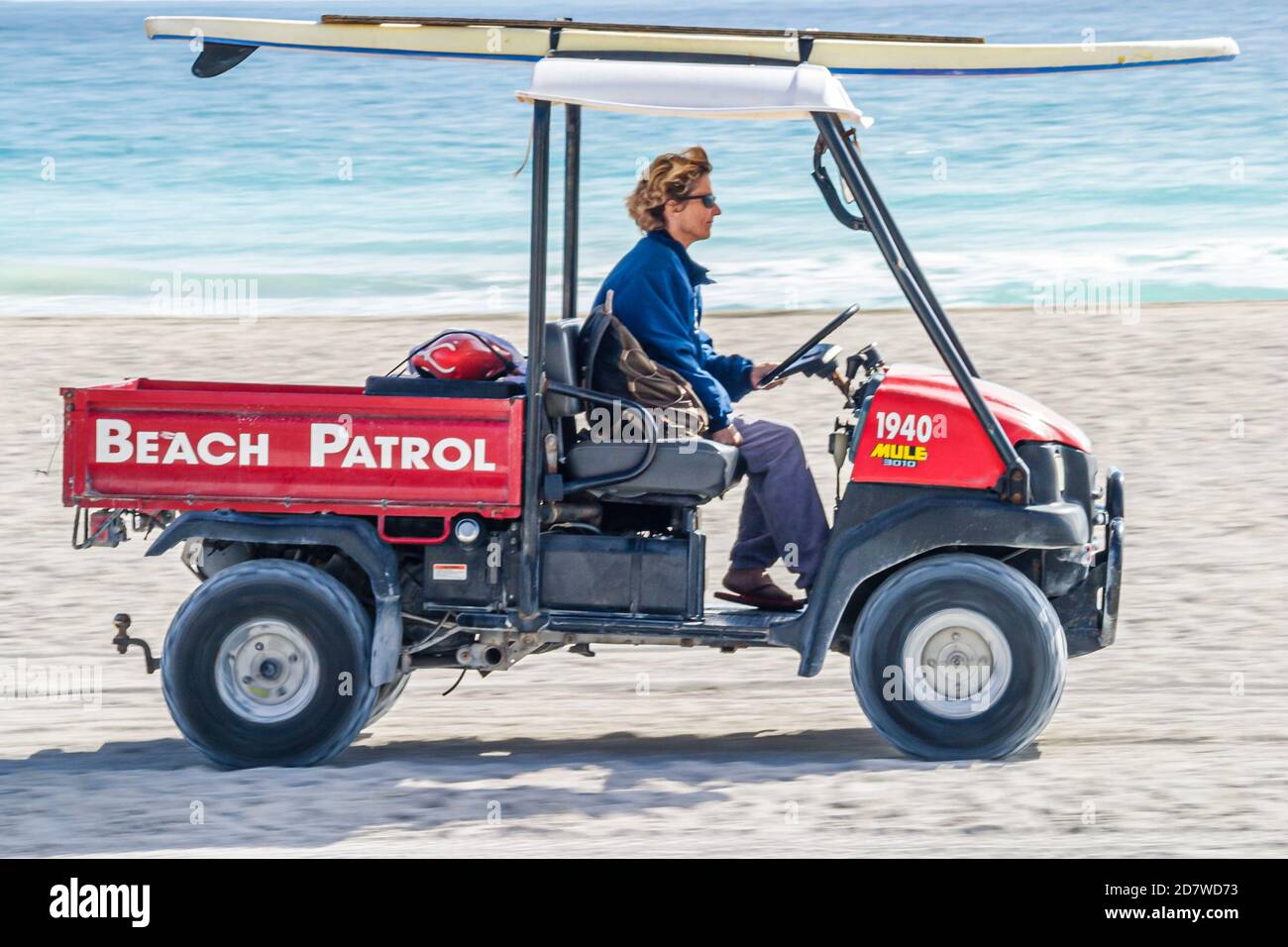 Miami Beach Florida,Atlantic Ocean seashore,patrol vehicle sand surf water, Stock Photo