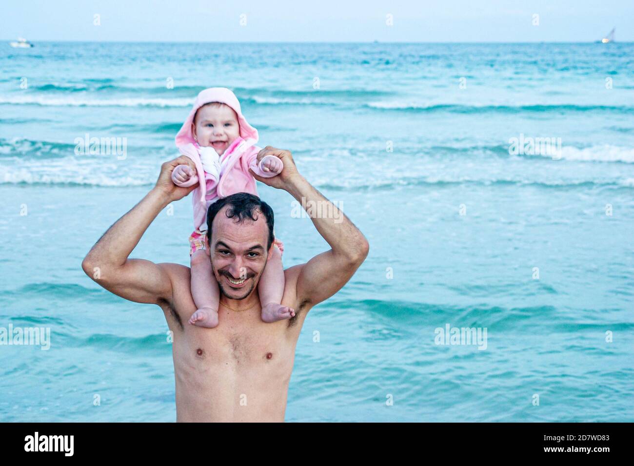 Miami Beach Florida,Atlantic Ocean seashore,Hispanic man father baby shoulders water, Stock Photo