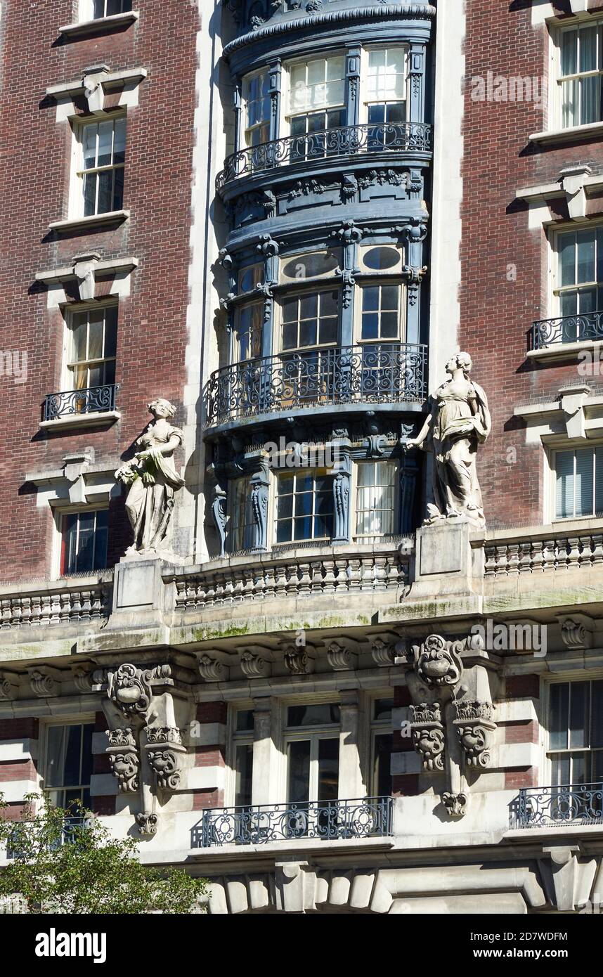 The opulent Beaux-Arts style limestone and brick exterior of the Dorilton, featuring monumental sculptures and balustraded balconies. Stock Photo